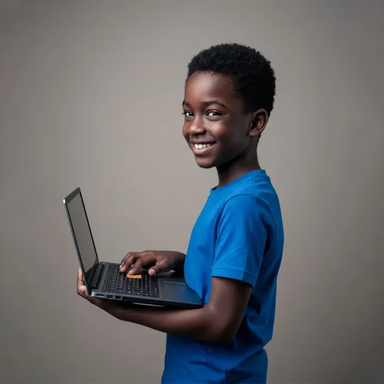 happy child holding a computer in their hands
